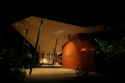 a building lit up at night with stars on it at Vyna Hillock Resort in Vythiri