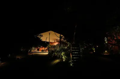 a night view of a building in the dark at Vyna Hillock Resort in Vythiri