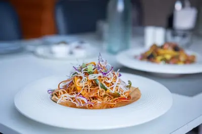 a white plate of food on a table at Zone Connect by The Park Coimbatore in Coimbatore