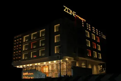 a building with a lit up sign on top of it at Zone Connect by The Park Coimbatore in Coimbatore