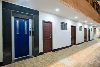 a row of doors in a hallway at IVY RESIDENCY in Coimbatore