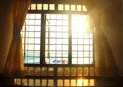 a window with a view of a swimming pool at Cherai Beach Residency in Cherai Beach
