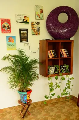 a room with a potted plant and a shelf at Bohemian Hideaway by Futurve in Kodaikānāl