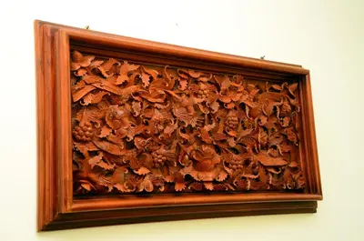 a picture of a wooden carving on a wall at Bohemian Hideaway by Futurve in Kodaikānāl