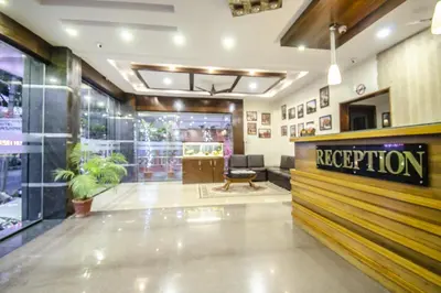 a store lobby with a reception desk and a waiting room at Hotel Sunshine in Mysore