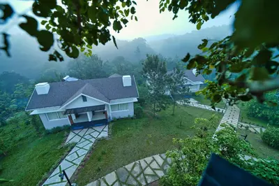 a house on a hill with a view at Jungle Bay Resorts & Spa in Wayanad