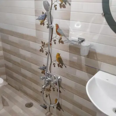 a bathroom with birds on the shower curtain at HAVEN COTTAGE in Ooty