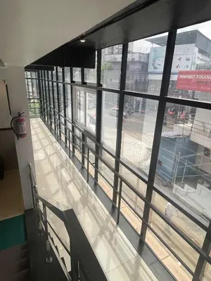 a building with a view of a street from a window at ABUDHABI RESIDENCY in Palakkad