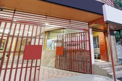 an entrance to a building with metal gates at Super Townhouse Mysore City Centre Formerly Hotel Mahendra in Mysore