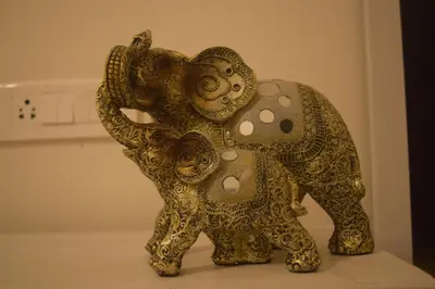 a figurine of an elephant on a table at S ELLA Residency in Kotagiri