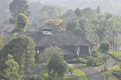 a house with a chimney on top of it at Jeevess Retreat Wayanad in Wayanad