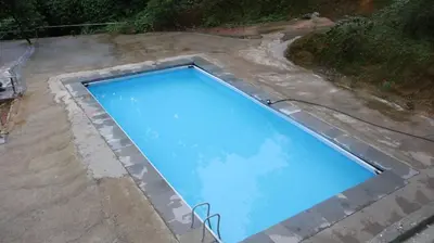 an overhead view of a swimming pool in a backyard at Rambler Garden Resort in Idukki