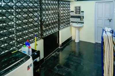 a bathroom with a sink and a toilet at Belljem Homes -your own private resort -2 BHK GF in Trichūr