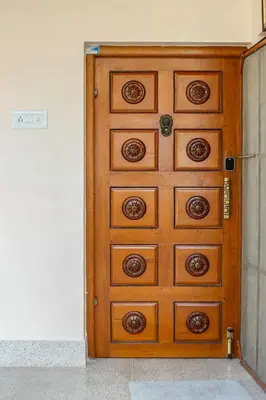 a wooden chest of drawers in a room at Belljem Homes -your own private resort -2 BHK GF in Trichūr
