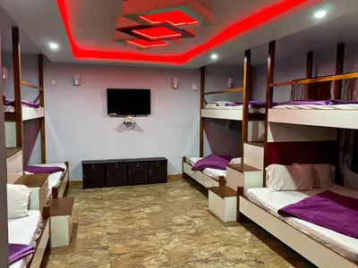 a room with a bunch of bunk beds at MAGIC MIST RESORT in Ooty