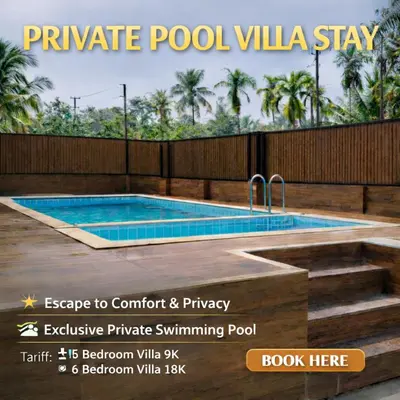 a swimming pool with a wooden fence and a swimming at Bachan's Casa The Private Pool Villa Cherai in Cherai Beach