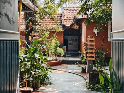 an entrance to a house with a garden at Ambadi's villa -Lake view resort in Pallipuram