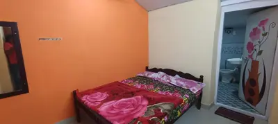 a small bedroom with a bed in a room at Honeybee Homestay by The Jungle Stay Groups in Vālpārai