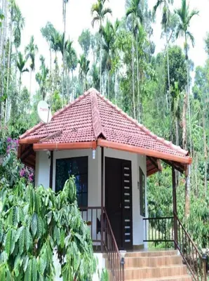 a small house with a red roof at Green Coorg by StayApart, Madikeri in Madikeri