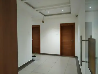 a hallway with two doors in a building at MEDLEY REGENCY in Palakkad
