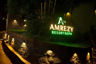 a neon sign that reads emergency responseresistasia at night at Amrezy Resort and Spa by Stride, Wayanad in Vythiri