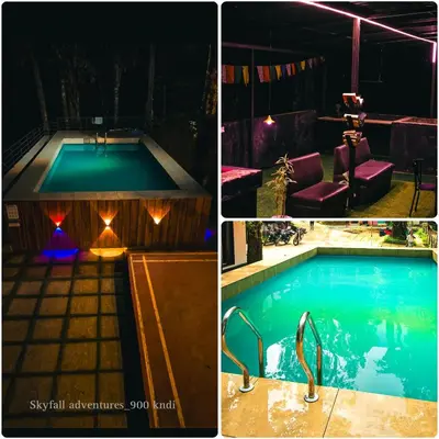 two pictures of a swimming pool at night with lights at Skyfall 900kandi in Meppādi