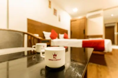 a coffee cup on a table in a room at KINGS CALICUT in Kozhikode