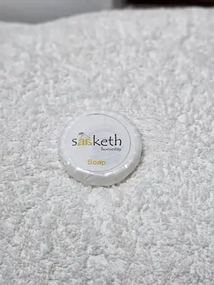 a white object with the words sans teeth on it at Saaketh Holiday Home in Kozhikode