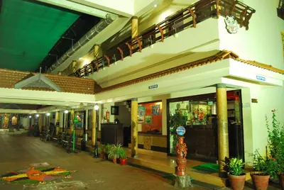 a lobby of a building with plants in it at Guruvayoor Resort in Guruvāyūr