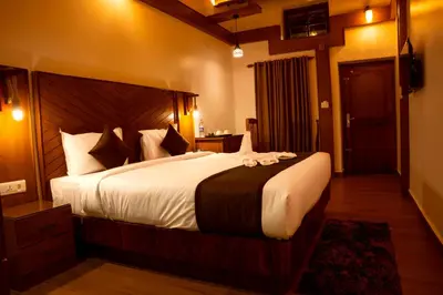 a bedroom with a large bed in a room at Stephen's Legacy in Vattavada