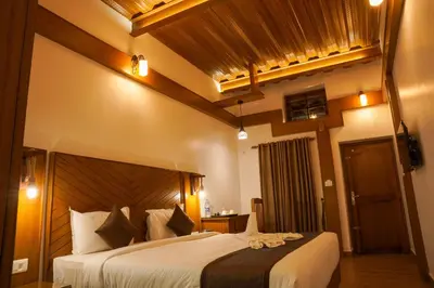 a bedroom with a large bed in a room at Stephen's Legacy in Vattavada