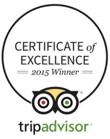 a logo for the center for excellence of equivalence with an owl at Srivar Hotels in Guruvāyūr