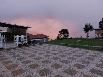 a brick patio in front of a house at Tranqville Resorts in Ooty