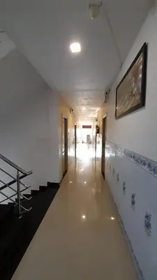 a hallway of a building with a swimming pool at SUPREME RESIDENCY in Coimbatore