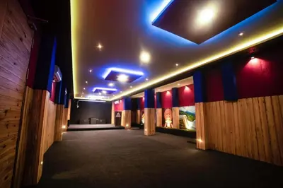 a hallway of a building with lights on the ceiling at Emerald Royal Residency in Cochin