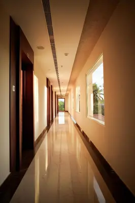 a hallway of a building with a window on the side at Valluvanad Residency in Perintalmanna