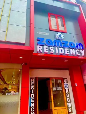 a store front with a sign for a restaurant at Zam Zam Residency in Cheruppulasseri