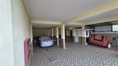 a room with a bed in the middle of a building at Karpagam Residency in Ooty