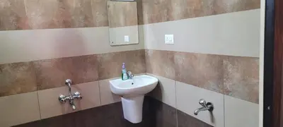 a bathroom with a sink and a toilet at Meghdoot river resort in Ernakulam