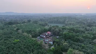 an aerial view of a house in the middle of a forest at Vajra Ayurveda and Yoga Retreat in Cochin