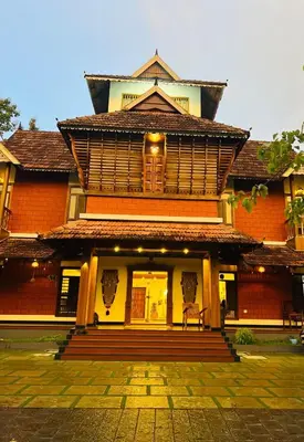 a large building with a staircase in front of it at Vajra Ayurveda and Yoga Retreat in Cochin