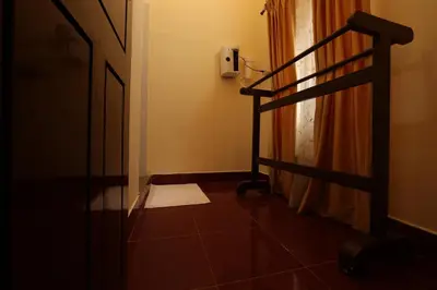 a hallway with a staircase and a door with a towel at Avadale Coorg - Stag Groups Not Allowed in Ammatti