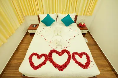 a bed with two hearts decorations on it at Misty Range Resorts , Marayoor in Marayoor