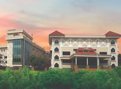 a rendering of a building in front of a sunset at Ashirvad Lawns Hotel & Convention Centre in Kozhikode