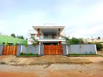 a house with an orange fence in front of it at Coimbatore Premium Private Villa a FAMILY RESORT kids, celebration hall in Coimbatore