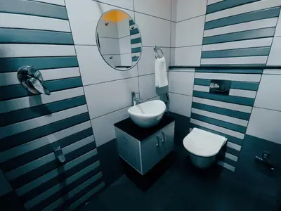 a bathroom with a sink and a toilet at Golden Peak Estate Homestay in Wayanad