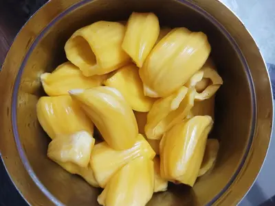 a bowl full of peeled bananas on a table at Golden Peak Estate Homestay in Wayanad