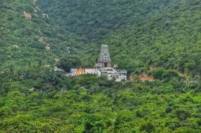 a house on a hill in the middle of a mountain at SHI's Bhairavi Peaceful 2bhk villa - - On the way 2 isha-Adiyogi , Maruthamalai in Coimbatore