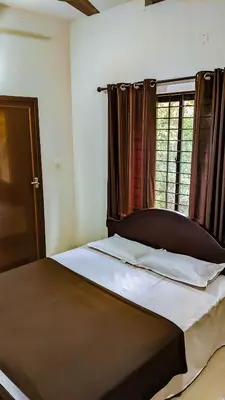 a large bed in a bedroom with a window at Shangri-laa hotel apartments in Tāzhekkod