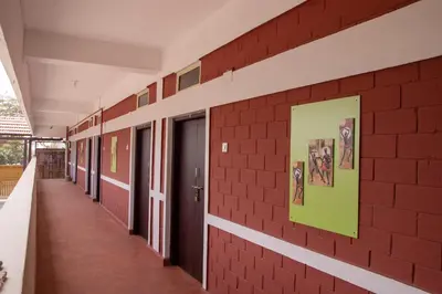 a hallway of a school with a brick wall at Deepwoods Stay-Kinathukadavu, Coimbatore in Coimbatore